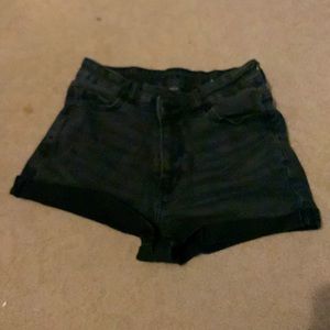 Black stretchy American Eagle jeans with a cross over waist